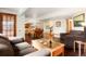 Spacious basement featuring a comfortable seating area, perfect for relaxing or entertaining guests at 7955 S Bemis St, Littleton, CO 80120