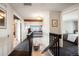 Bright hallway with hardwood floors, connecting bedrooms and overlooking the downstairs dining room at 7955 S Bemis St, Littleton, CO 80120