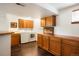 Functional laundry room with built-in cabinets, washer, and dryer, offering ample storage space for laundry essentials at 7955 S Bemis St, Littleton, CO 80120