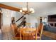 Open-concept living space with dining room, staircase, and comfortable seating area with a fireplace at 7955 S Bemis St, Littleton, CO 80120