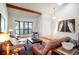 Inviting living room featuring hardwood floors, neutral paint colors, and cozy furnishings at 7955 S Bemis St, Littleton, CO 80120