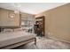 Neutral bedroom with a queen bed, desk, and view of the outside from the balcony at 8600 E Alameda Ave # 21-208, Denver, CO 80247