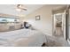 Bright and spacious bedroom with a full bed, a large window and closet with access to the bathroom at 9625 E Center Ave # 5D, Denver, CO 80247