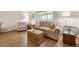 Inviting living room featuring a comfortable brown sofa and stylish decor, perfect for relaxation and entertaining guests at 9625 E Center Ave # 5D, Denver, CO 80247