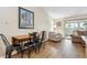 Cozy living room with natural light, complemented by hardwood floors and access to an outdoor balcony at 9625 E Center Ave # 5D, Denver, CO 80247