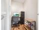 Small office space featuring wood flooring, storage cabinets and a work space at 9625 E Center Ave # 5D, Denver, CO 80247