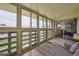 Sunroom showcasing several windows providing exterior views and seating at 9625 E Center Ave # 5D, Denver, CO 80247
