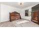 Spacious bedroom features a ceiling fan, dresser, window and carpet flooring at 4602 Genoa St, Denver, CO 80249