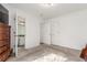 Bright bedroom featuring two closets and an attached bathroom at 4602 Genoa St, Denver, CO 80249