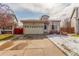 Charming single Gathering home featuring an attached two car garage, and manicured front yard at 4602 Genoa St, Denver, CO 80249