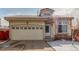Inviting single-Gathering home featuring an attached two-car garage and a welcoming front entrance at 4602 Genoa St, Denver, CO 80249