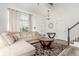 Bright living room features a large window, hardwood floors, and a neutral color palette at 4602 Genoa St, Denver, CO 80249