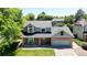 Charming two-story home with a brick facade, covered porch and a well-manicured lawn at 982 E 130Th Cir, Thornton, CO 80241