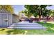 Cozy backyard deck with seating, a grill, a table, and mature trees at 982 E 130Th Cir, Thornton, CO 80241