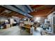 Unfinished basement providing ample storage and potential for customization with exposed beams at 982 E 130Th Cir, Thornton, CO 80241
