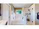 Bright bathroom featuring a bathtub, glass-enclosed shower, and white subway tile walls for a clean and modern look at 982 E 130Th Cir, Thornton, CO 80241