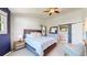 Spacious bedroom featuring a king-sized bed, vaulted ceiling, large window, with an open entry to the en-suite bathroom at 982 E 130Th Cir, Thornton, CO 80241