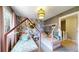 Cozy bedroom featuring two twin-sized beds with charming house-shaped frames and playful wallpaper for a whimsical touch at 982 E 130Th Cir, Thornton, CO 80241
