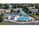 Aerial view of a community pool with tennis and sand volleyball courts at 982 E 130Th Cir, Thornton, CO 80241