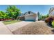 Charming two-story home with a brick facade, two-car garage and long driveway at 982 E 130Th Cir, Thornton, CO 80241