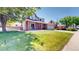 Charming two-story home with a brick facade, covered porch and a well-manicured lawn at 982 E 130Th Cir, Thornton, CO 80241
