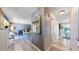 Inviting hallway with wood-look flooring that flows into an open-concept dining and living space at 982 E 130Th Cir, Thornton, CO 80241