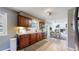 The kitchen features wooden cabinets, granite countertops, stainless steel appliances, and wood floors adjacent to the dining area at 982 E 130Th Cir, Thornton, CO 80241