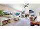 Bright living room offers a cozy fireplace, built-in shelves, and a large window at 982 E 130Th Cir, Thornton, CO 80241