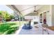 Outdoor covered patio perfect for relaxation and entertainment, with backyard views and a ceiling fan at 982 E 130Th Cir, Thornton, CO 80241