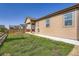 Backyard view shows a grassy lawn with a wood fence around the perimeter of the property at 9679 Waco St, Commerce City, CO 80022
