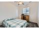 Bright bedroom featuring a cozy bed, natural light, and a desk for a comfortable and functional space at 9679 Waco St, Commerce City, CO 80022