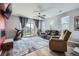 Cozy living room with plush seating, a sliding door to the backyard, and modern decor for a relaxing atmosphere at 9679 Waco St, Commerce City, CO 80022