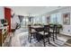 Open living space featuring a dining area, access to the back yard, and comfortable seating at 9679 Waco St, Commerce City, CO 80022