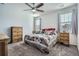 Comfortable main bedroom with natural light, neutral decor, and a ceiling fan for a relaxing retreat at 9679 Waco St, Commerce City, CO 80022