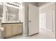 Bright bathroom with vanity storage, and tiled floors at 15475 Andrews Dr # 401, Denver, CO 80239