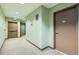 Building hallway featuring access to multiple units and stairwell at 15475 Andrews Dr # 401, Denver, CO 80239