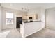 Bright kitchen featuring neutral paint, light cabinets, and black appliances at 15475 Andrews Dr # 401, Denver, CO 80239