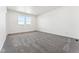 A bright and spacious bedroom featuring plush carpet and natural light from two windows at 3639 Recess Ln, Castle Rock, CO 80108