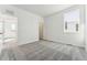A bright bedroom features a window, plush carpet, and neutral walls at 3639 Recess Ln, Castle Rock, CO 80108