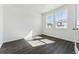 Bright bedroom featuring two large windows, providing natural light at 3639 Recess Ln, Castle Rock, CO 80108