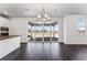Bright dining area with modern light fixture and large sliding glass doors overlooking backyard at 3639 Recess Ln, Castle Rock, CO 80108