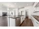 Modern kitchen island with stainless steel appliances and pantry, ideal for meal preparation and storage at 3639 Recess Ln, Castle Rock, CO 80108