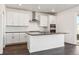 Modern kitchen island with sleek countertop, stainless appliances, and ample storage space at 3639 Recess Ln, Castle Rock, CO 80108