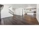 Spacious living area with stairs and sleek kitchen, offering a modern and inviting atmosphere at 3639 Recess Ln, Castle Rock, CO 80108