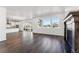 Open-concept living area with abundant natural light, seamlessly connecting the kitchen, dining, and living spaces at 3639 Recess Ln, Castle Rock, CO 80108