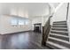 Living room featuring hard wood floors, fire place, and lots of natural light at 3639 Recess Ln, Castle Rock, CO 80108