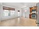 Light-filled living room with hardwood floors and access to a balcony at 1975 N Grant St # 721, Denver, CO 80203