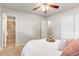 Cozy bedroom featuring neutral walls, plush carpet, and a convenient ensuite bathroom with tiled shower at 602 Birch St, Broomfield, CO 80020