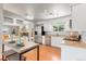 Bright kitchen features stainless steel appliances, butcher block countertops, and a breakfast nook with modern lighting at 602 Birch St, Broomfield, CO 80020