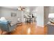 Open-concept living space with hardwood floors, leading to a modern kitchen and dining area at 602 Birch St, Broomfield, CO 80020